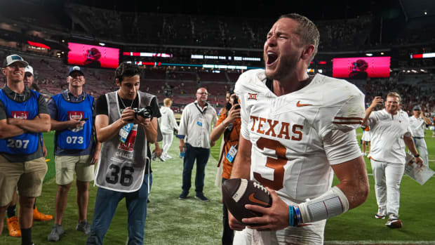 Texas quarterback Quinn Ewers yells while leaving the field after beating Alabama.